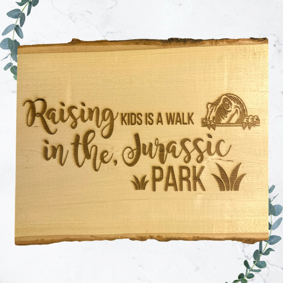 Wood Sign: Raising Kids is a walk in the Jurassic Park - 13"x11